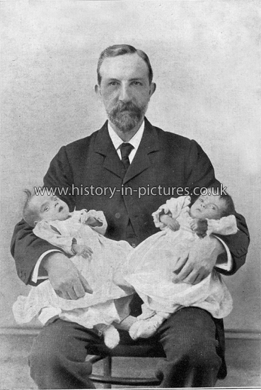 Rev. W J Mayers ( Deputation Secretary} and two of Dr. Barnardo's baby Waifs. c.1910